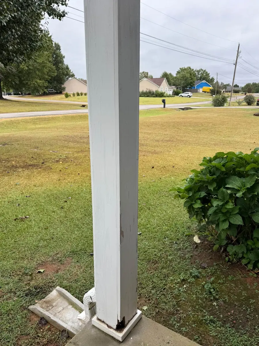 White porch post on a front porch